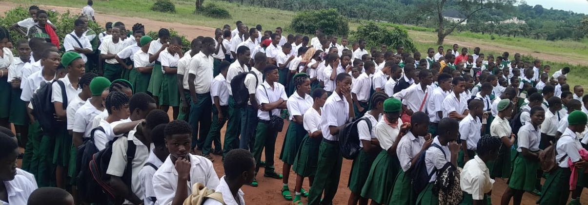 Students of Ihitte Ezinihitte Secondary Technical School lined up at morning assembly in green and white uniform